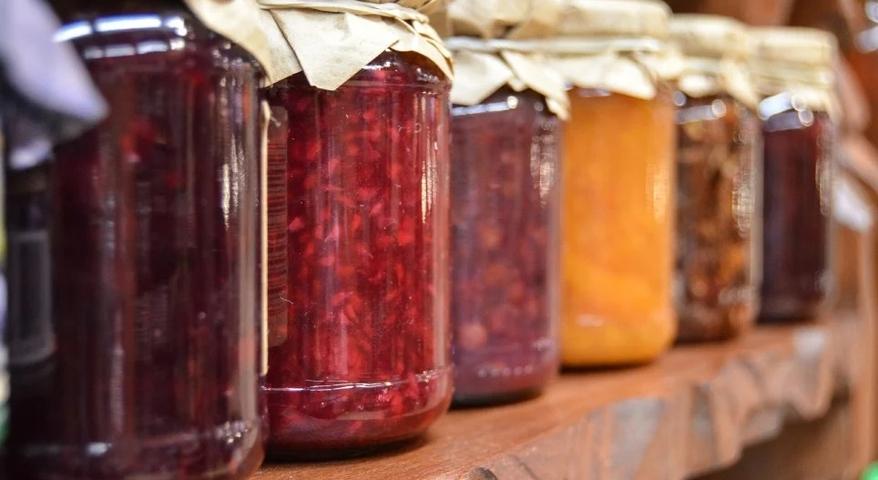 Canning Jars full of canned food pm a counter
