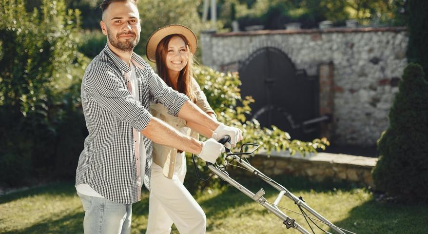 Choosing the Right Lawn Mower Blog | Picture of Couple mowing the lawn together