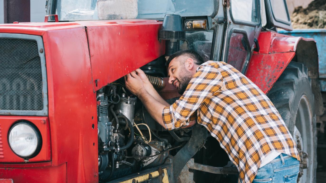 Man fixing a tractor