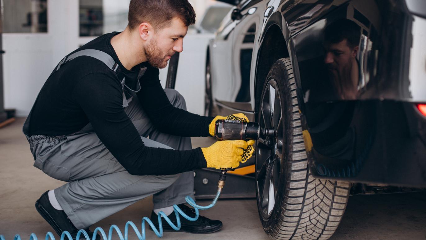 Mechanic using pneumatic tool