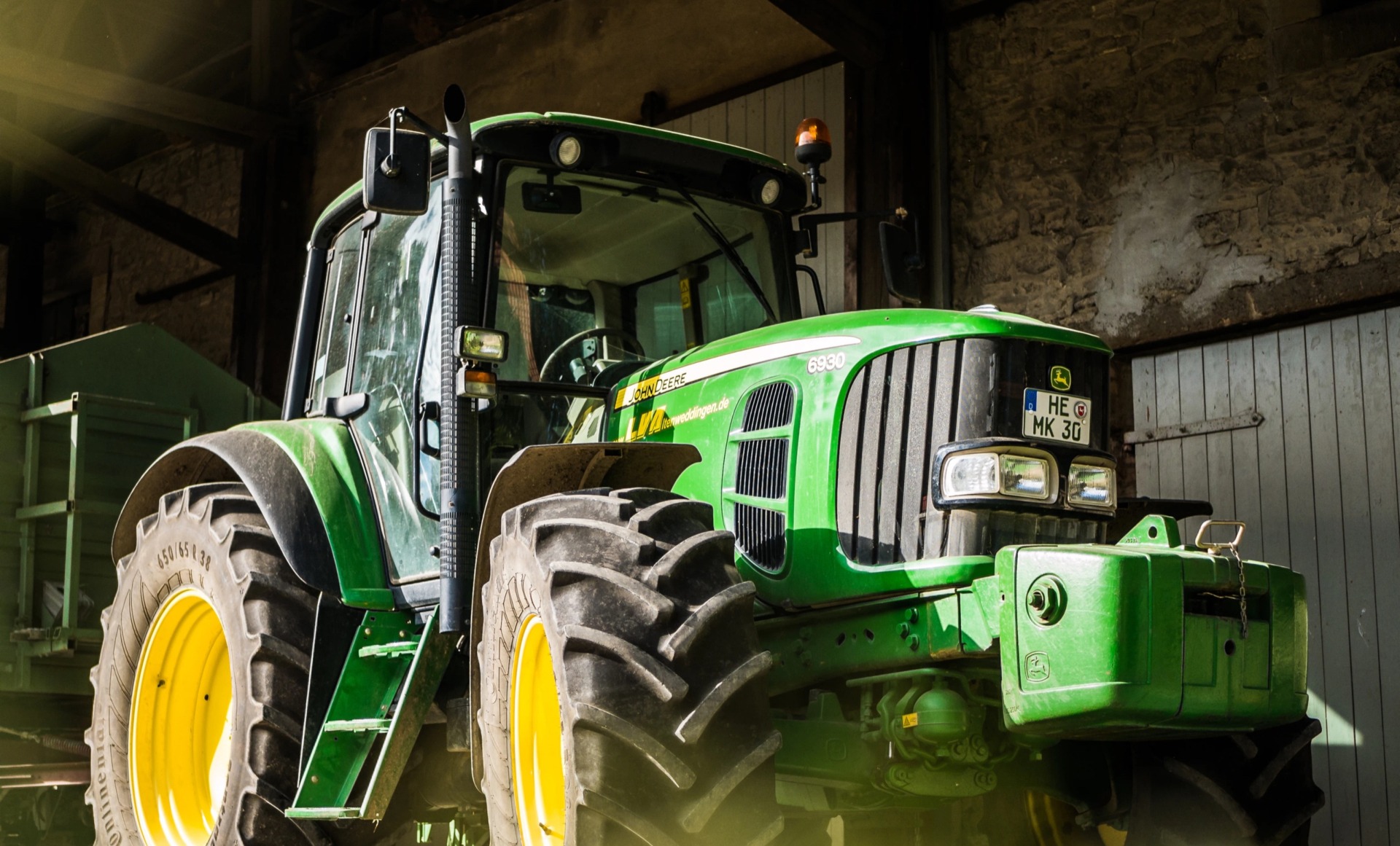 John Deer in a barn Tractor