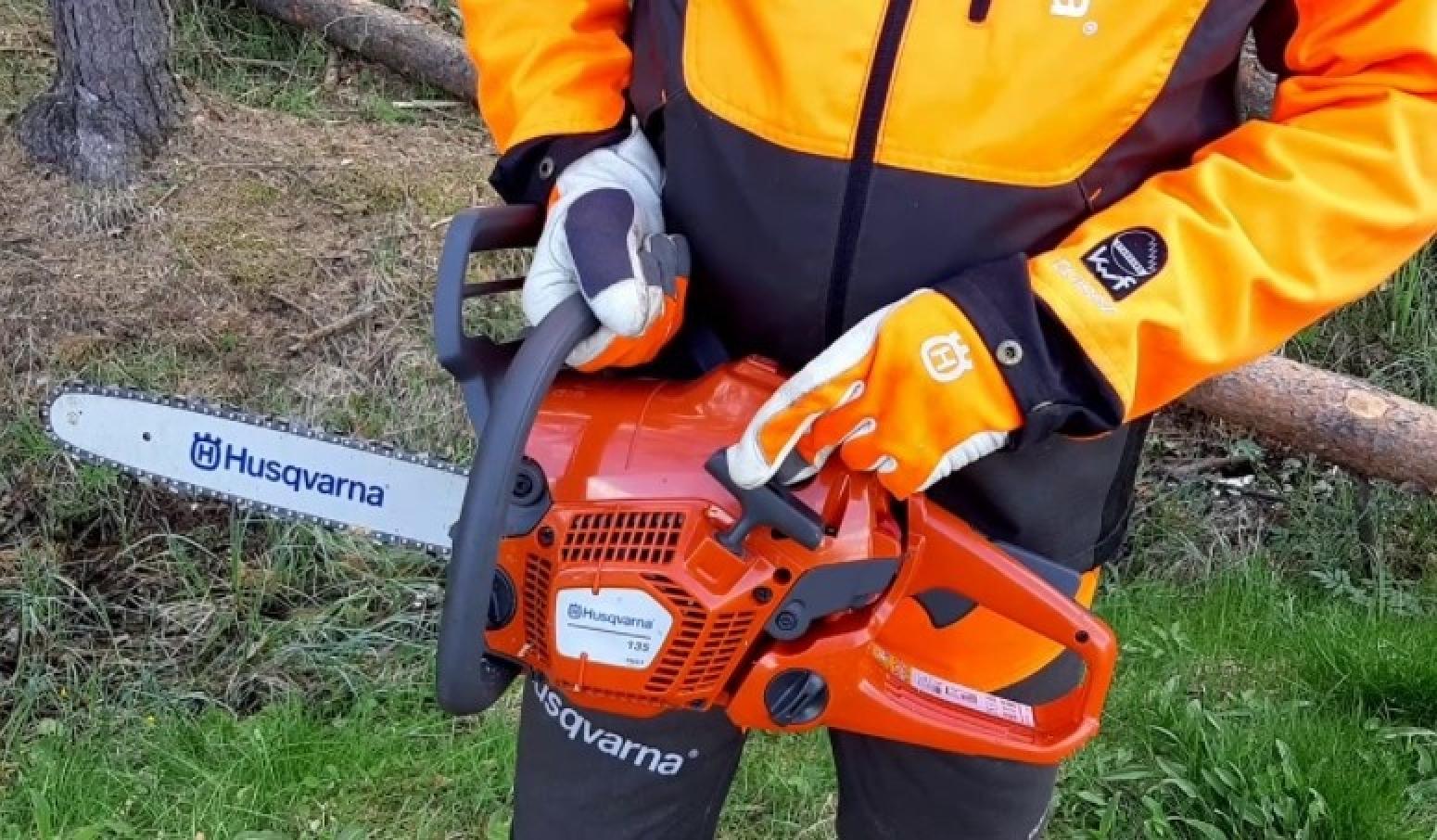 Husqvarna 135 Mark II 16 in. 38cc 2-Cycle Gas Chainsaw Person Holding