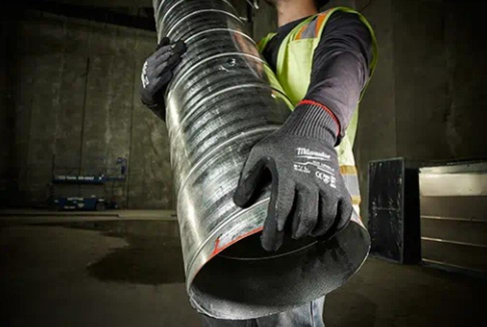 Milwaukee Cut Level 5 Nitrile Dipped Gloves on Model Carrying Pipe