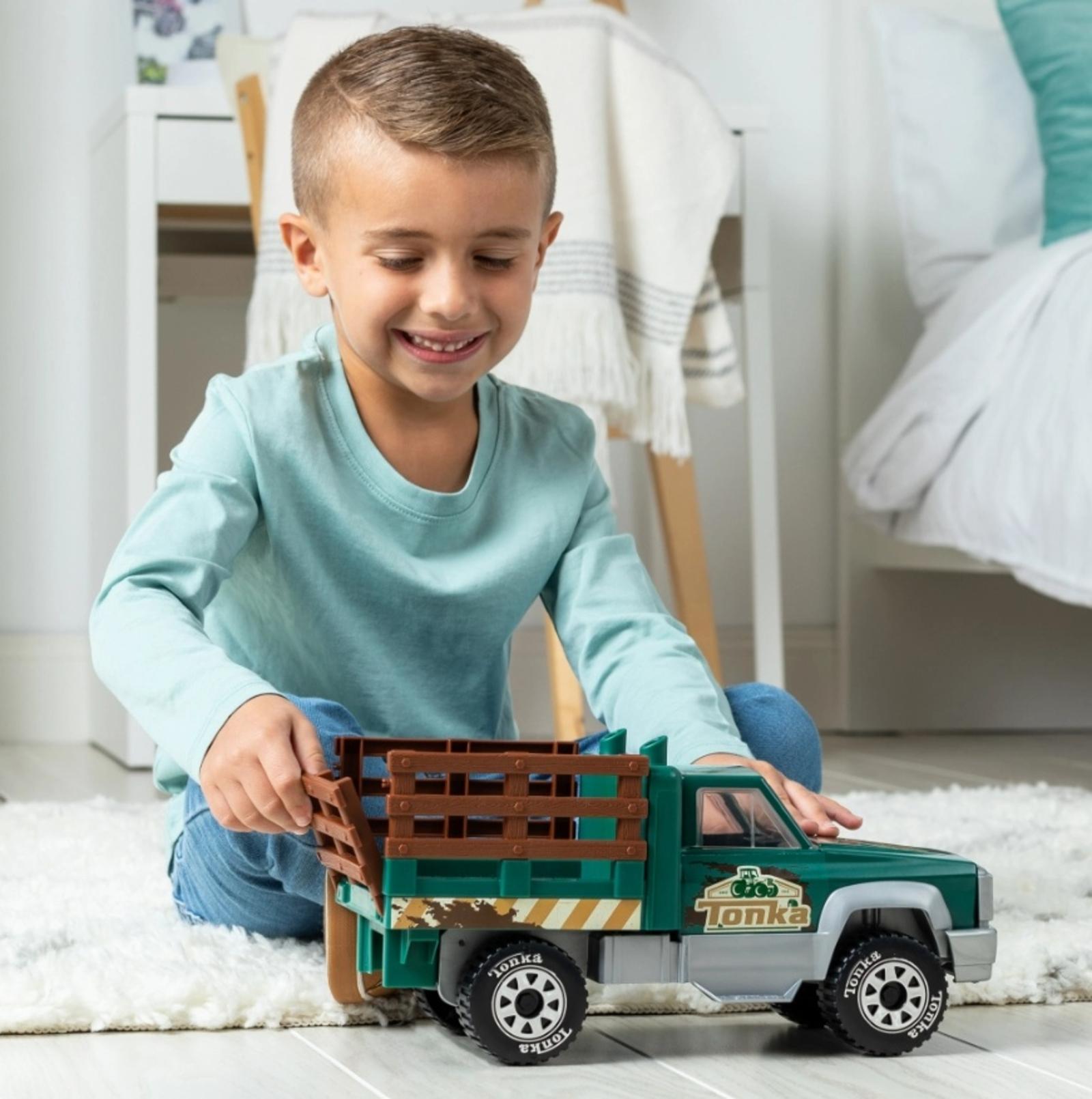  kid playing with truck
