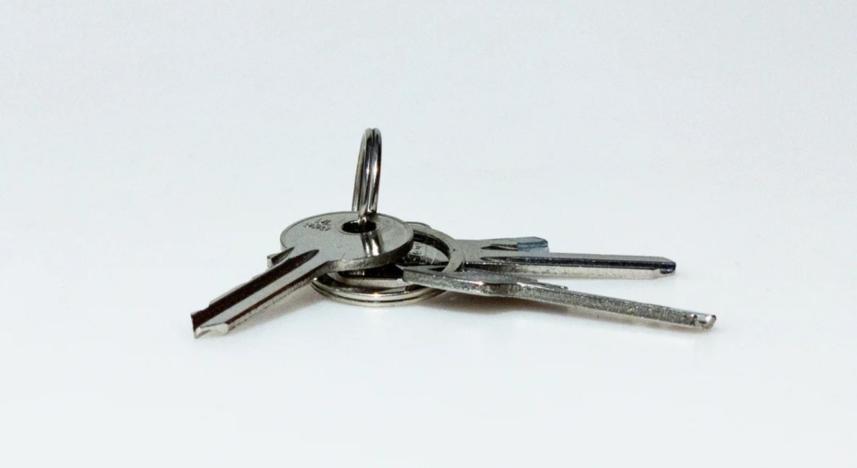 Keys on a key ring on a white background
